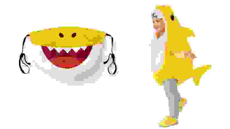 A yellow Baby Shark mask and a toddler in a Baby Shark costume