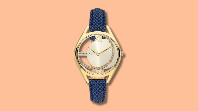 The Kenneth Cole New York Transparency Blue Strap Watch features genuine leather and gold.