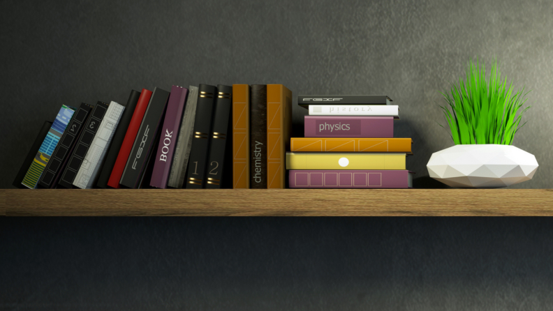 Books stacked horizontally and vertically on a shelf.