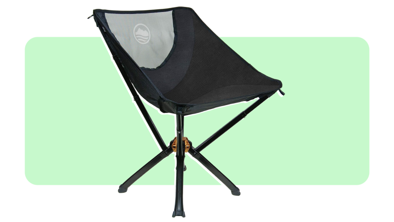 A Cliq chair in the color black on a green and white background.