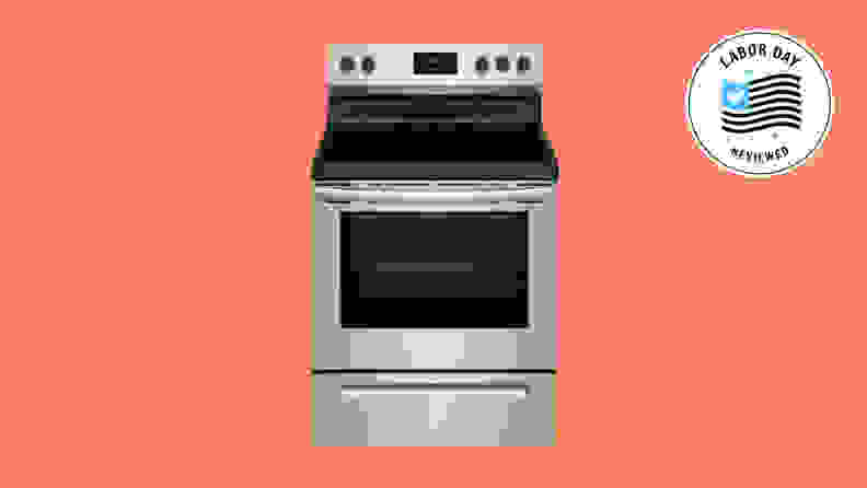A silver electric range on a salmon background that has a Labor Day badge.