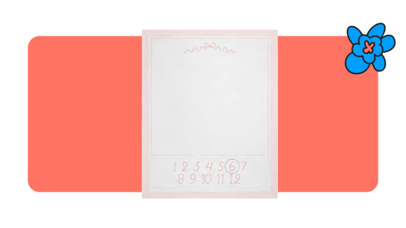 baby milestone blanket on orange and white background