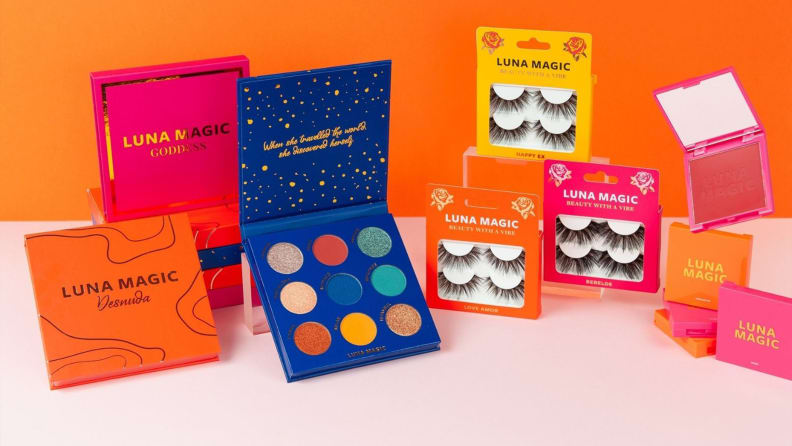 Makeup displayed on a table with an orange background