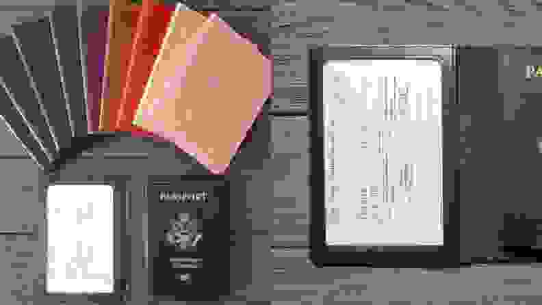 Assorted, multi-colored passport book. On right, vaccination card inside of passport book.