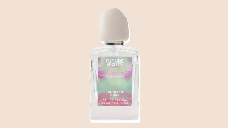 A bottle of Future Society Haunted Rose perfume against a neutral background.