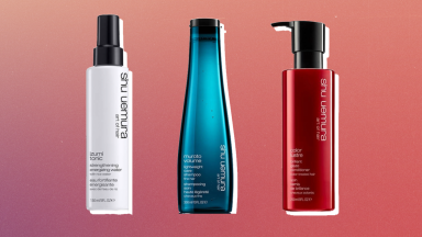 Shu Uemura styling spray, shampoo, and conditioner against a red background.