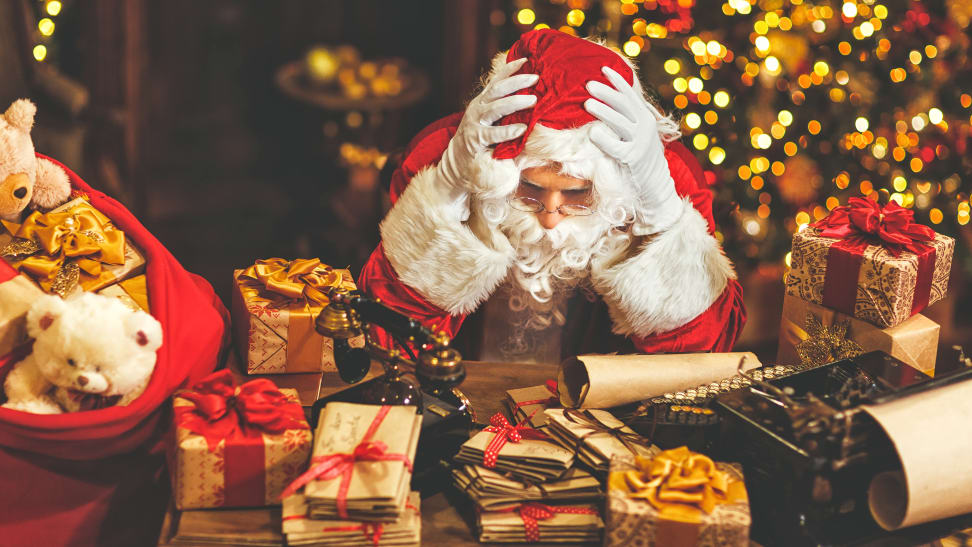 Frustrated Santa staring at too many presents.