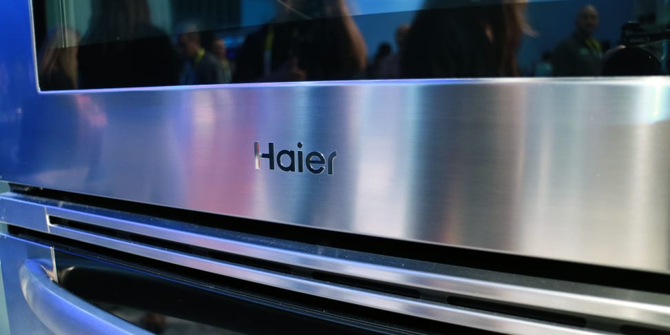 Closeup of the Haier logo on its full-size double wall oven