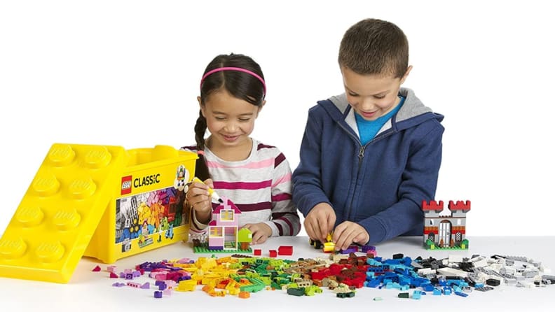 Two kids playing with Legos