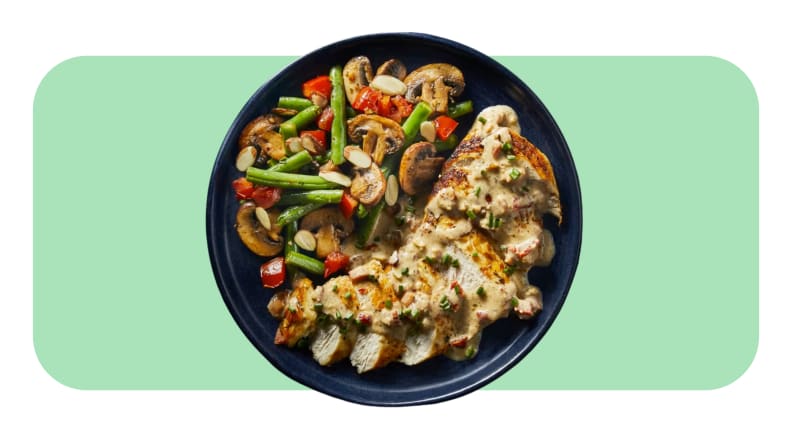 A served plate of Chicken with Creamy Bacon Sauce and veggies from the Green Chef meal kit.