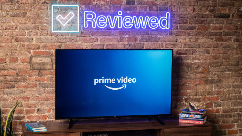 The Amazon Fire TV 4-Series displaying the Prime Video home screen in a living room setting