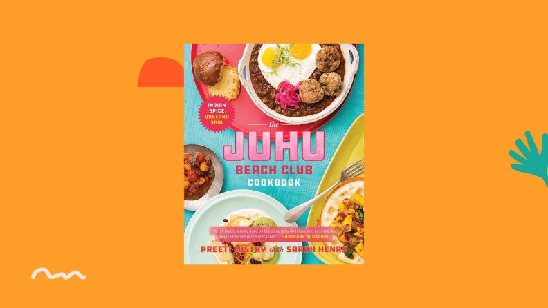 Juhu Beach Club cookbook against a bright orange background.