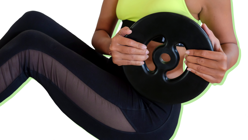 A person working out with a weight plate.