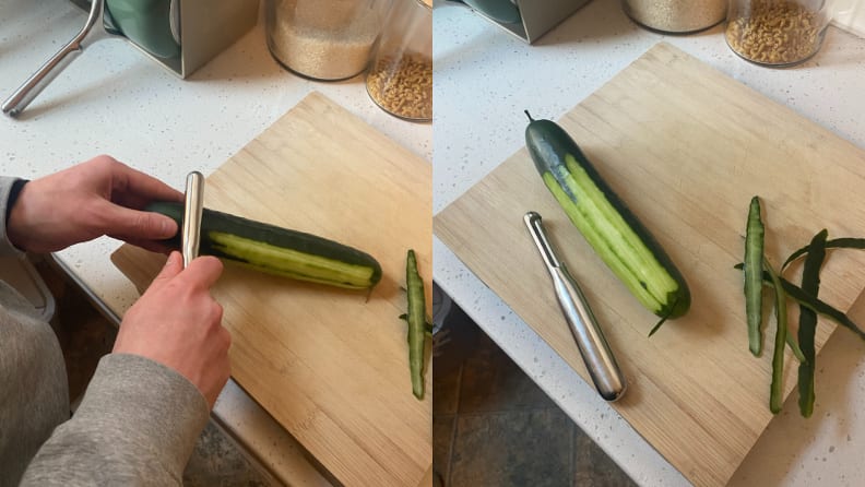 Person using a peeler to peel skin off of a cucumber on top of a wooden cutting board.