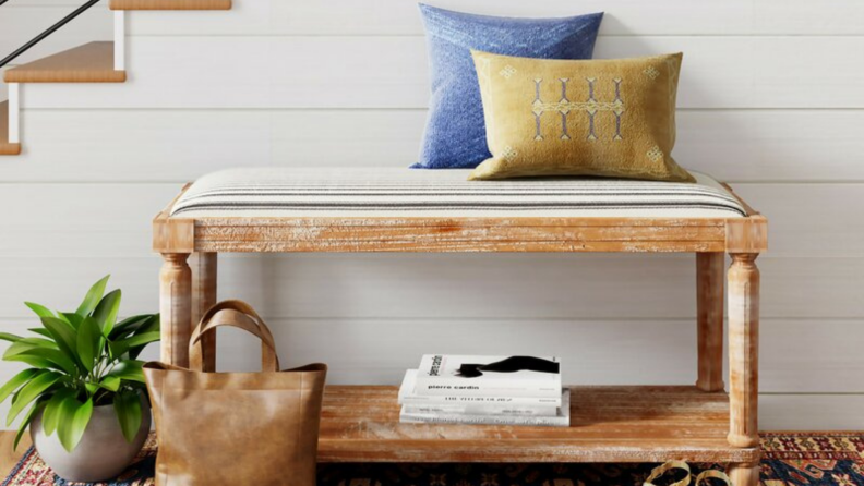 A Breakwater Bay bench sits in an entryway.