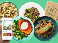 Prepared plates, a hand holding a phone displaying a meal kit app, and a meal kit box on a green background