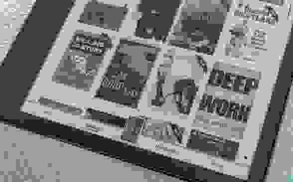 Close-up view of a Kindle display menu with various book covers.