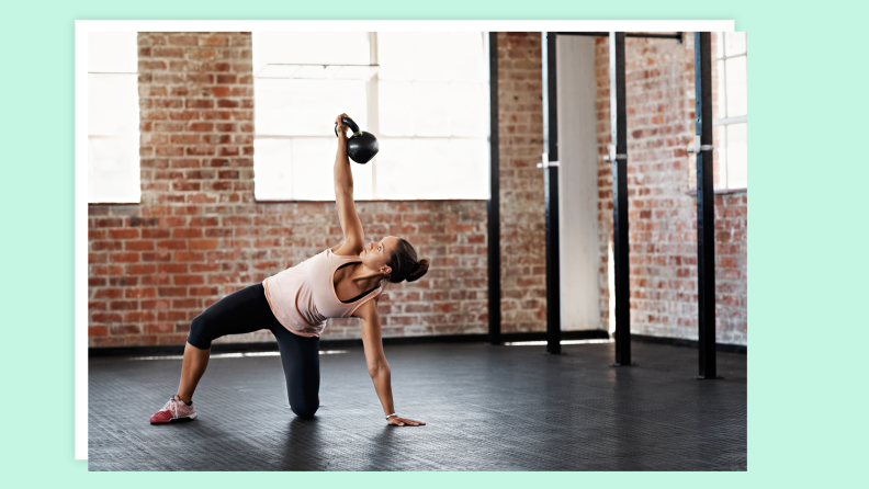 A person doing home workouts with a kettlebell.