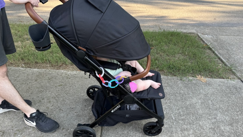 Man pushing a baby in a stroller