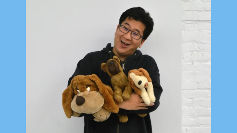 man holding stuffed animals