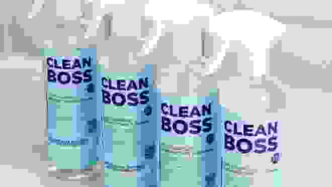 Four spray bottles with blue labels.
