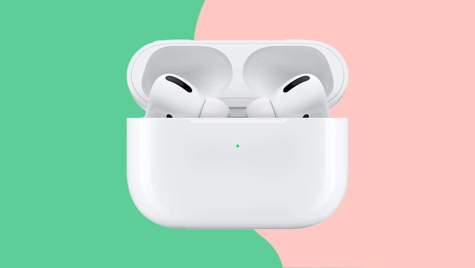 Wireless earbuds in front of pink and green background.