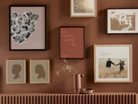 Frames photos on red wall