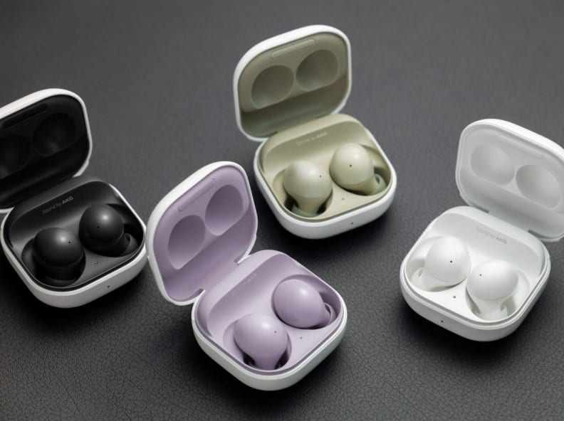 Multi-colored earbuds in their cases.