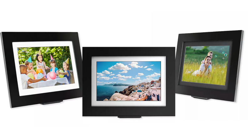 Three digital frames showing family photos.