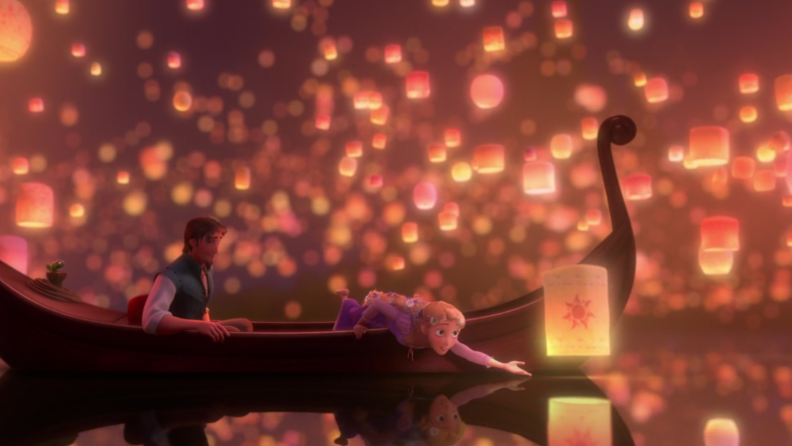 A still from 'Tangled' featuring Rapunzel and Flynn in a boat on a lake, surrounded by floating lanterns.