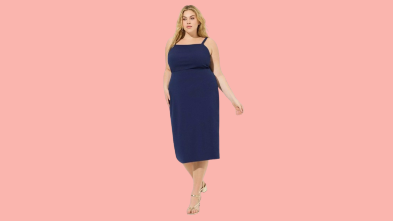 A model wearing a knee-length blue dress.