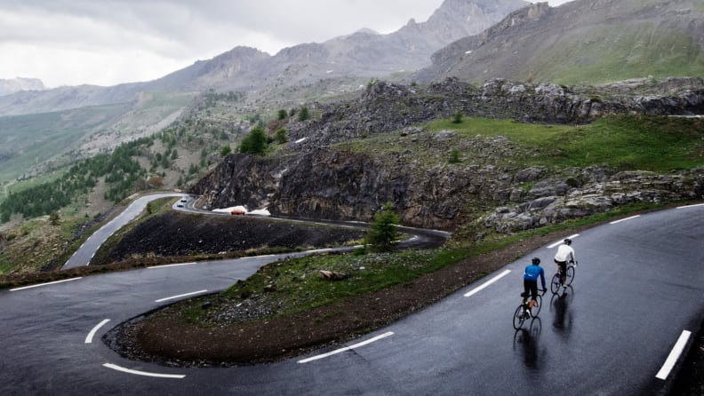 Bikers on a hilly road.