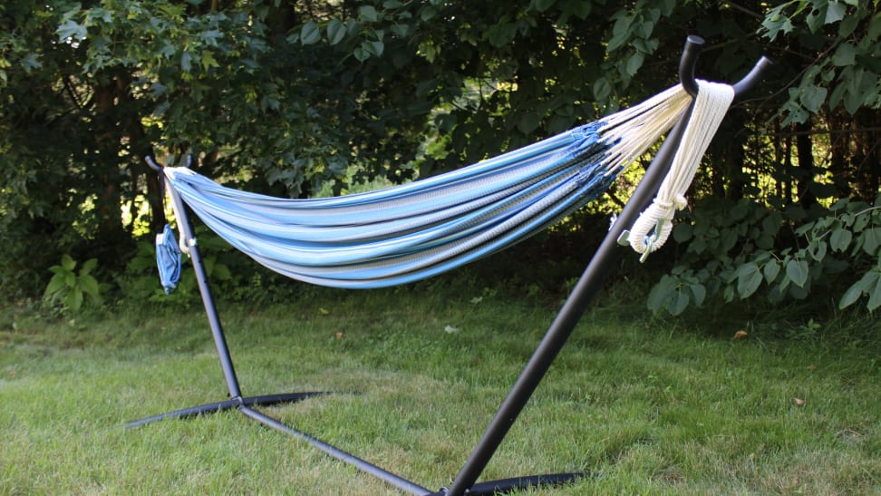 blue striped hammock set up in yard