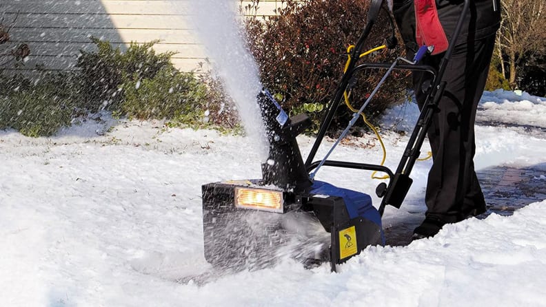 A close-up of the Snow Joe snowblower doing its thing: blowing snow.