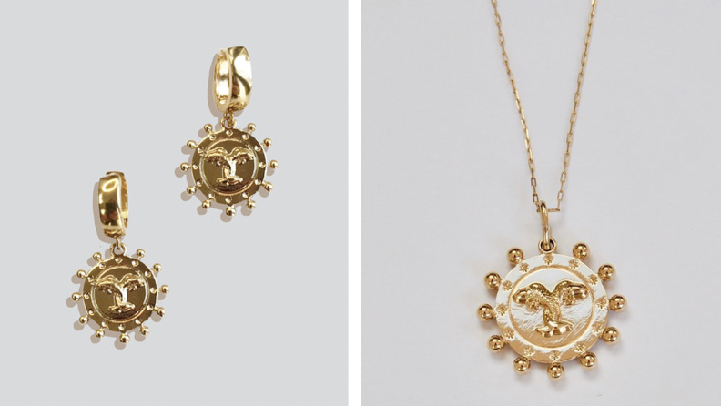 A pair of gold earrings and a gold pendant