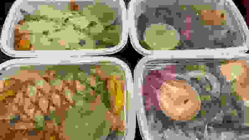 Four pre-packaged assorted meals from CookUnity in their individual containers.