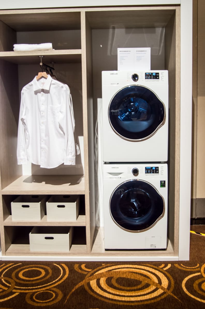 You'll save the most space if you stack the compact washer and dryer.