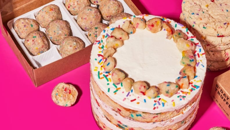 Funfetti birthday cake, funfetti cookies, and funfetti truffles on a neon pink surface.