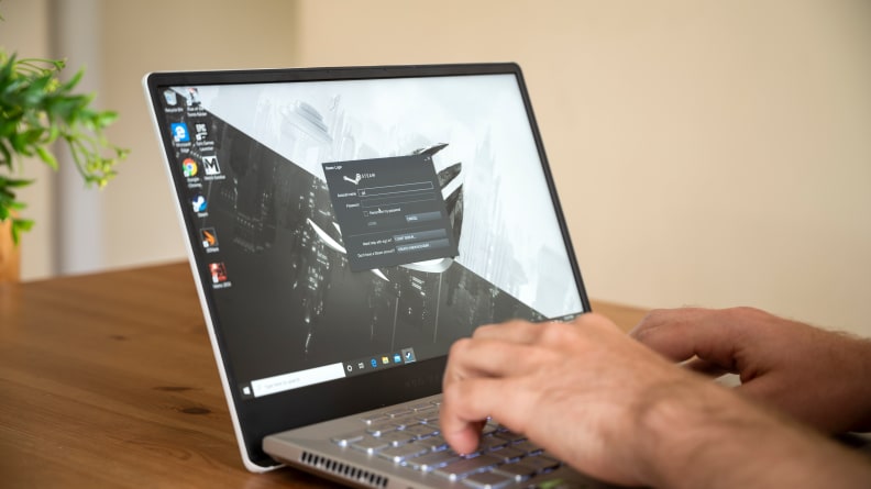 A picture of a person typing on the G14