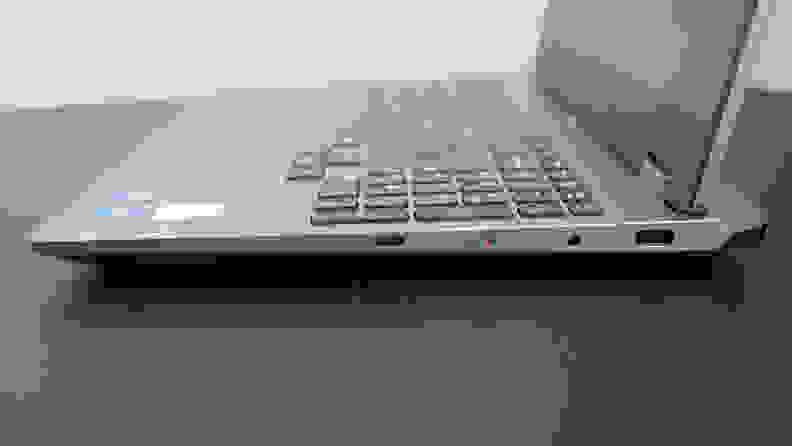 A side shot of a silver gaming laptop, the Lenovo Loq.