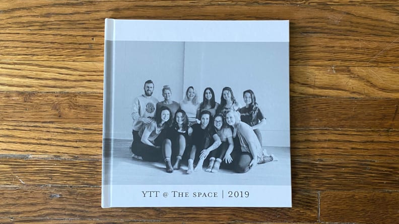 The Mixbook photo book on a wood table