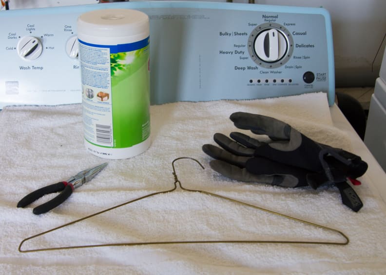 Pliers, cleaning wipes, wire coat hanger, and gloves for safety's sake