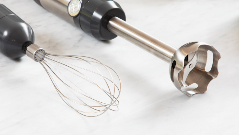 GE Immersion Blender next to whisk attachment on top of granite surface.