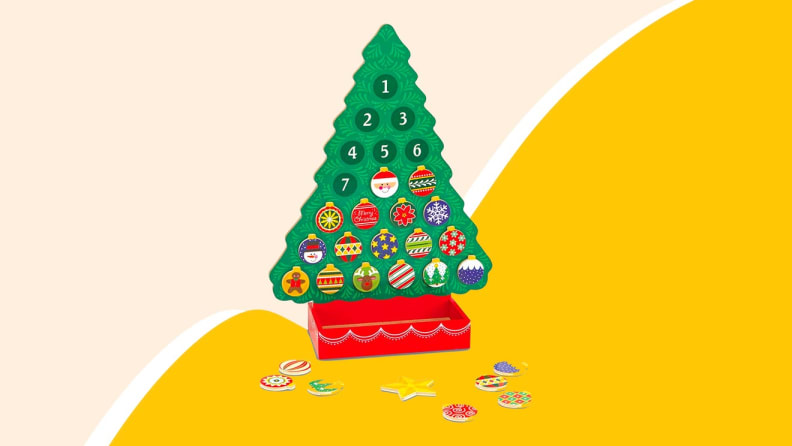 Christmas tree toy on yellow background