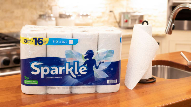 A pack of Sparkle paper towels sitting on a kitchen counter.