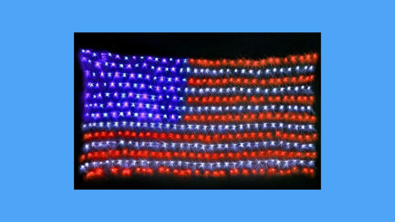 An LED American flag against a blue background.