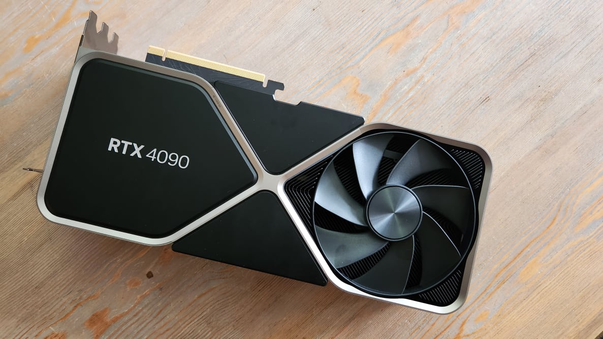 A Nvidia GeForce RTX 409 in black resting on a wooden surface.