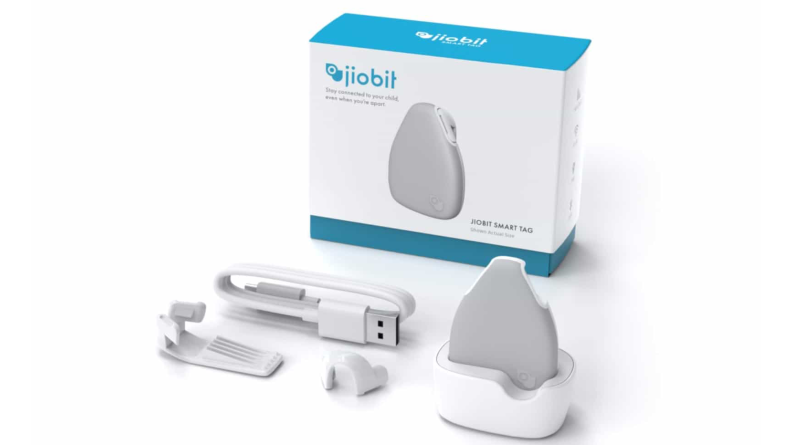 A Jiobit GPS tracker sits next to its packaging.