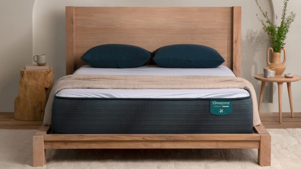 A Beautyrest Harmony Hybrid mattress in a bedroom background.
