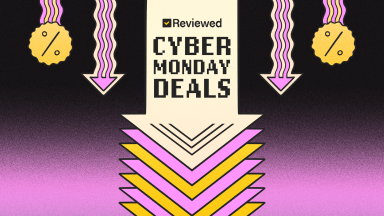 An illustration of a large down arrow on a black and pink background with the words Reviewed Cyber Monday Deals at the center and discount symbols on the sides.